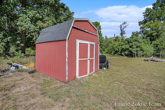 view of outbuilding with a lawn