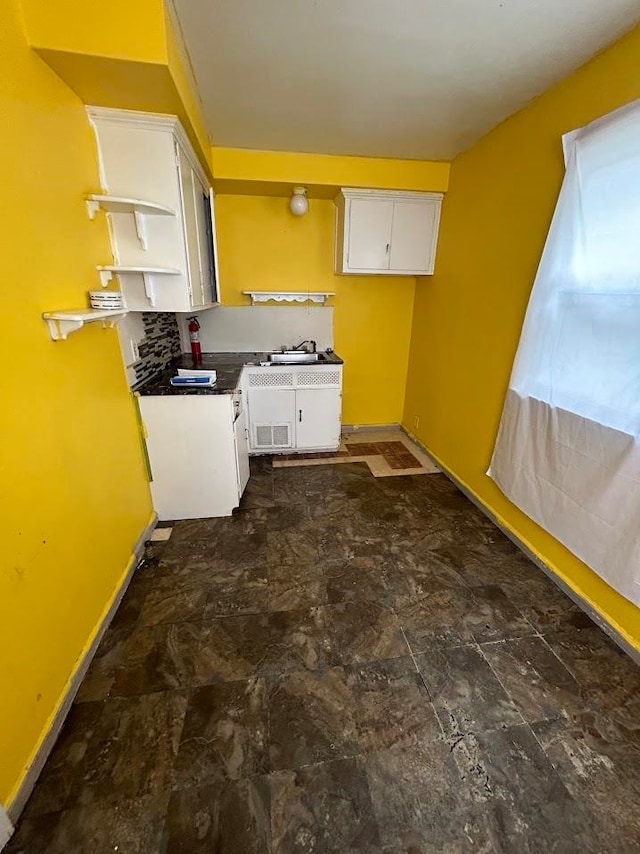 kitchen with sink and white cabinets