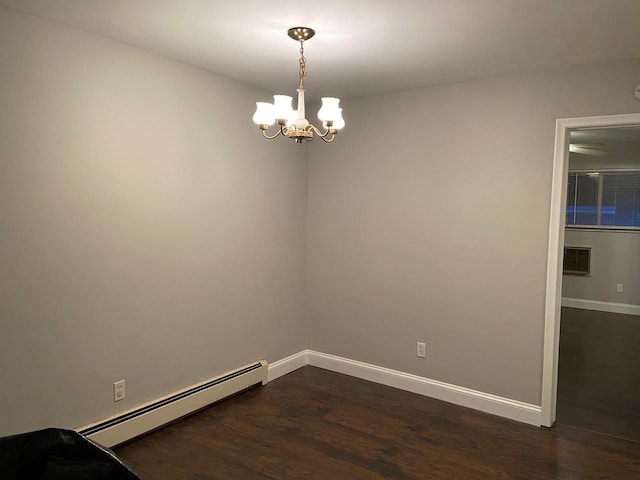 17161 Redford St Unit 203, Detroit, MI 48219 - unfurnished room featuring a baseboard heating unit, dark wood finished floors, baseboards, and a chandelier