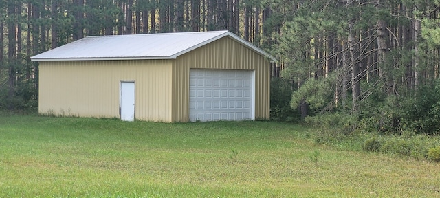 garage with a lawn