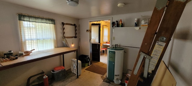 kitchen featuring butcher block counters and electric water heater