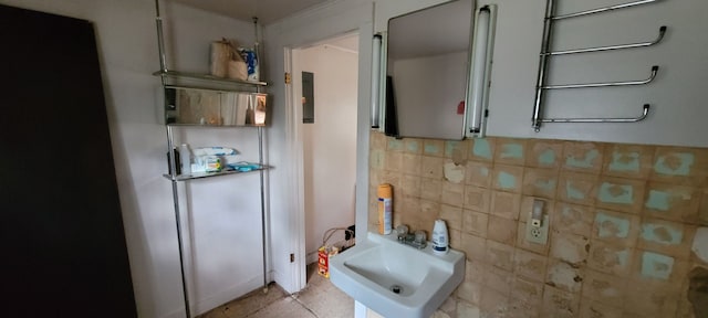 interior space with backsplash and sink