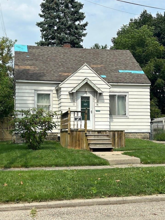 view of front of home with a front yard