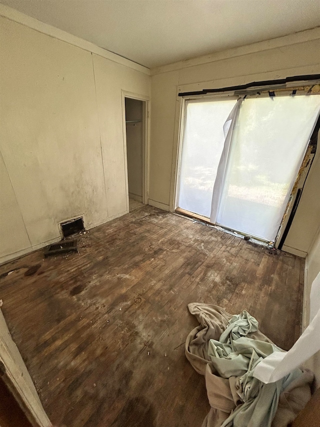 interior space with a closet and wood-type flooring