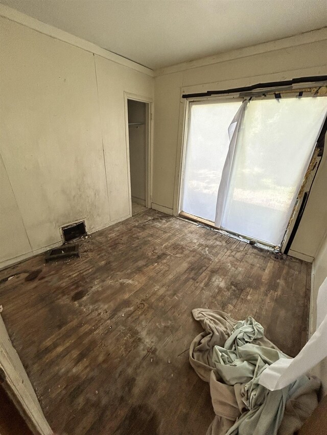 1028 Campbell St, Flint, MI 48507 - empty room featuring wood finished floors and crown molding