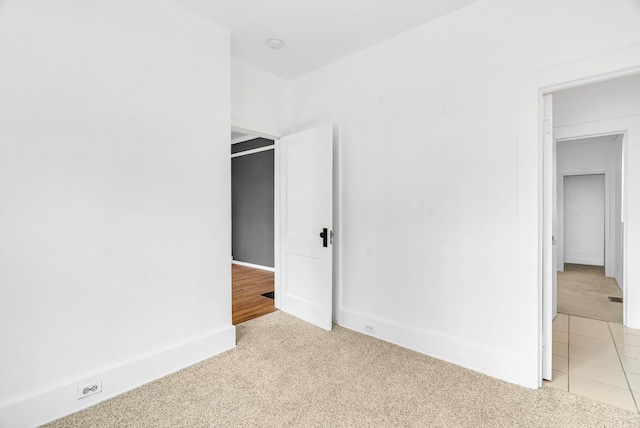 unfurnished bedroom featuring light colored carpet