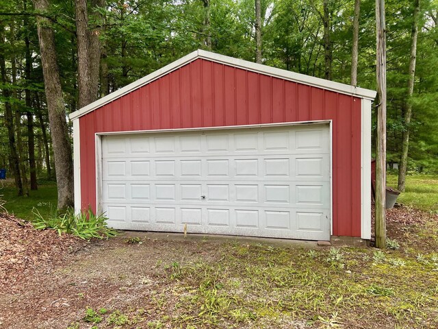 5576 S Whalen Lake Rd, Baldwin, MI 49304 - detached garage featuring view of wooded area