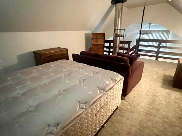 5576 S Whalen Lake Rd, Baldwin, MI 49304 - carpeted bedroom featuring lofted ceiling