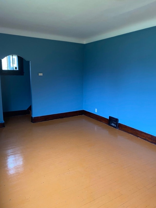 spare room featuring light wood-type flooring