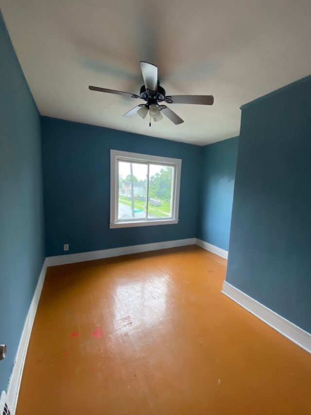 spare room featuring light wood-type flooring and ceiling fan