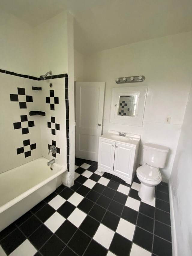 full bathroom with vanity, toilet, and tiled shower / bath