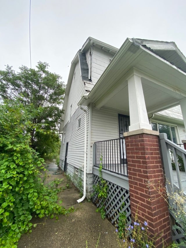 view of property exterior featuring a porch