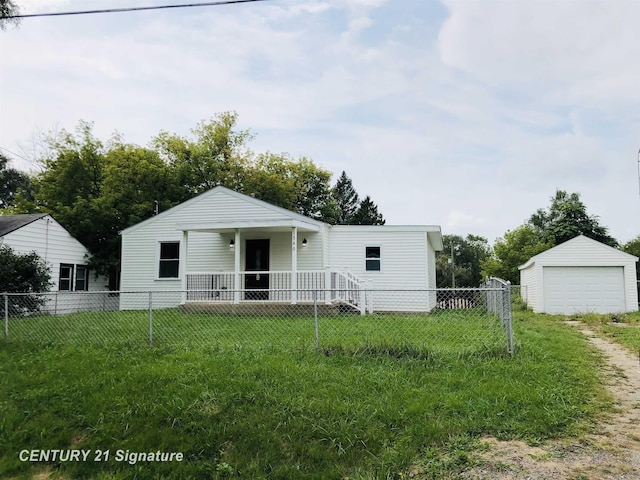 1540 Pound Dr, Flint, MI 48532 - view of front of house featuring a garage and an outdoor structure
