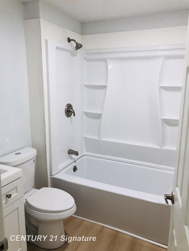 1540 Pound Dr, Flint, MI 48532 - bathroom with wood finished floors, toilet, shower / bathtub combination, and vanity
