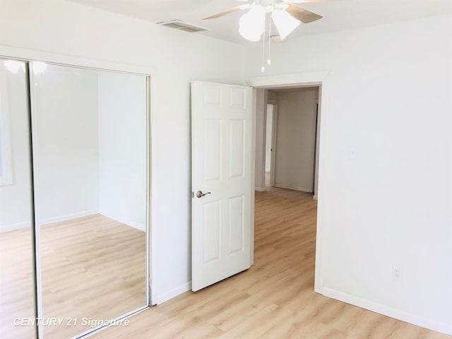 unfurnished bedroom with a closet, ceiling fan, and light hardwood / wood-style flooring