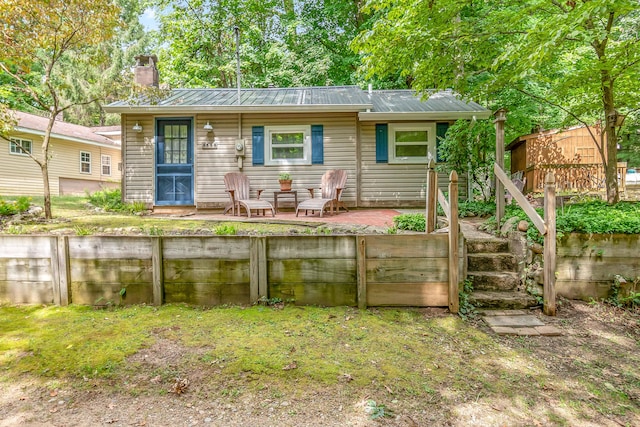 rear view of house featuring a patio area