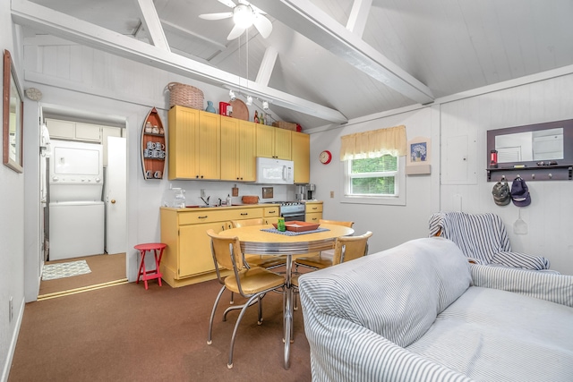 kitchen featuring stacked washer and clothes dryer, lofted ceiling with beams, stove, and dark colored carpet
