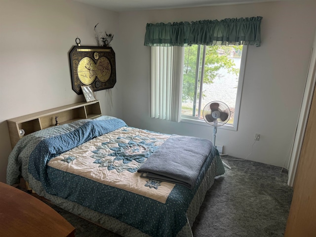 bedroom with dark carpet