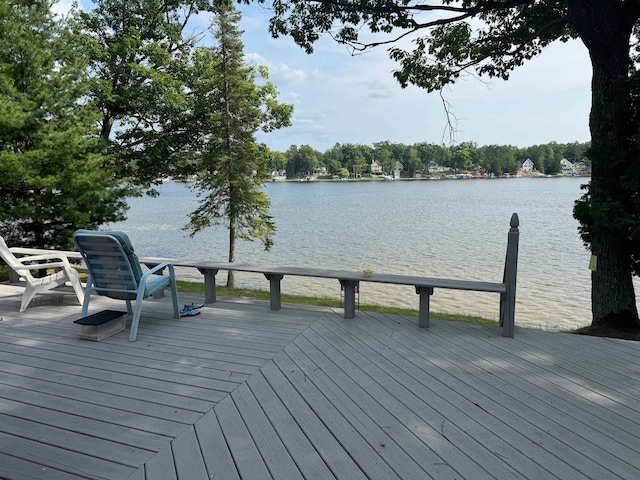 wooden deck with a water view