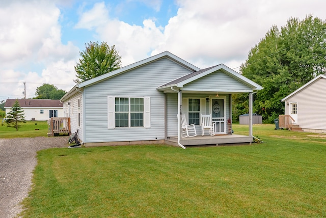 bungalow-style home with a porch and a front yard