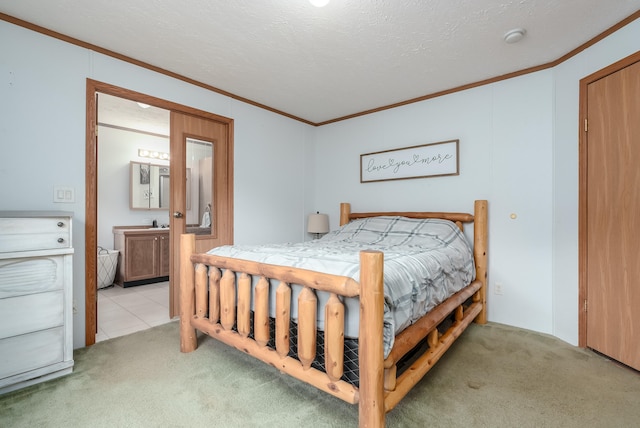 bedroom featuring a textured ceiling, crown molding, and light carpet