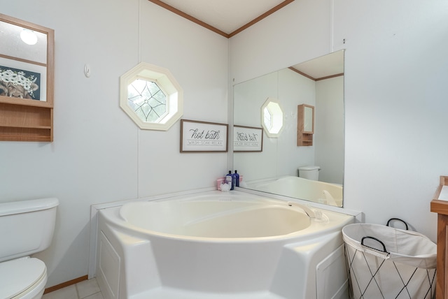 bathroom with a bathing tub, toilet, crown molding, and tile patterned floors