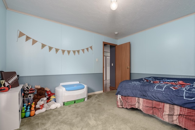 carpeted bedroom featuring a textured ceiling and ornamental molding