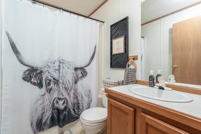 bathroom featuring walk in shower, vanity, a textured ceiling, crown molding, and toilet