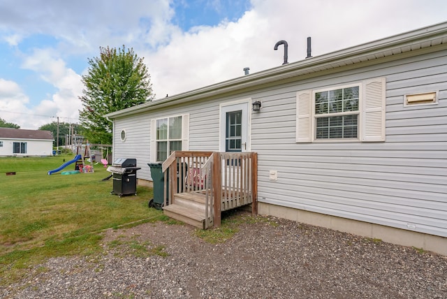 rear view of house with a lawn