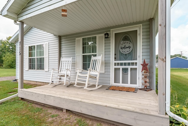 view of exterior entry featuring a porch