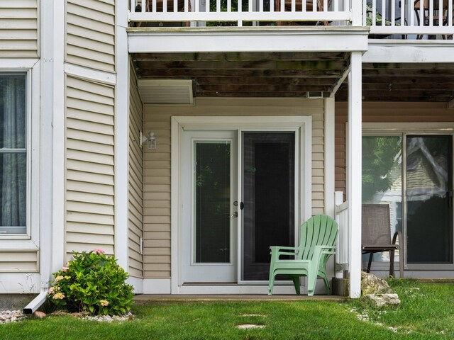 94 Charter Ct, Manistee, MI 49660 - view of exterior entry with a balcony