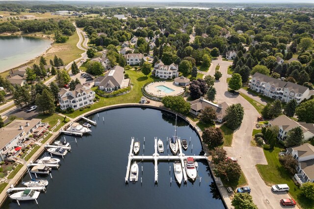 94 Charter Ct, Manistee, MI 49660 - aerial view of property and surrounding area featuring a nearby body of water