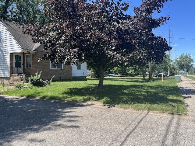 3329 120th Ave, Holland, MI 49424 - view of home's exterior with roof with shingles and a yard