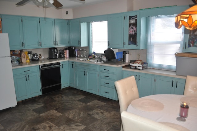 3329 120th Ave, Holland, MI 49424 - kitchen featuring dishwasher, freestanding refrigerator, a sink, and blue cabinetry