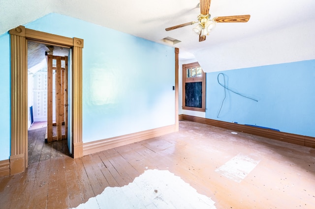 spare room with ceiling fan, hardwood / wood-style floors, and lofted ceiling