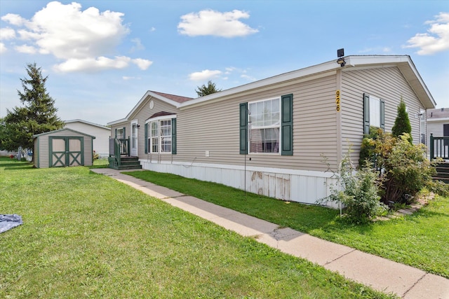 view of front of property featuring a front yard and a storage shed