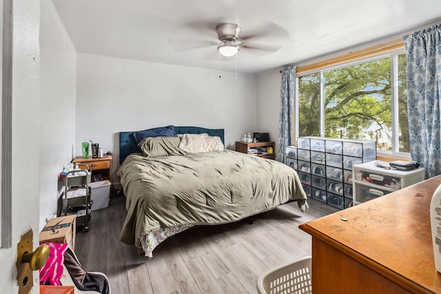 bedroom featuring hardwood / wood-style flooring and ceiling fan