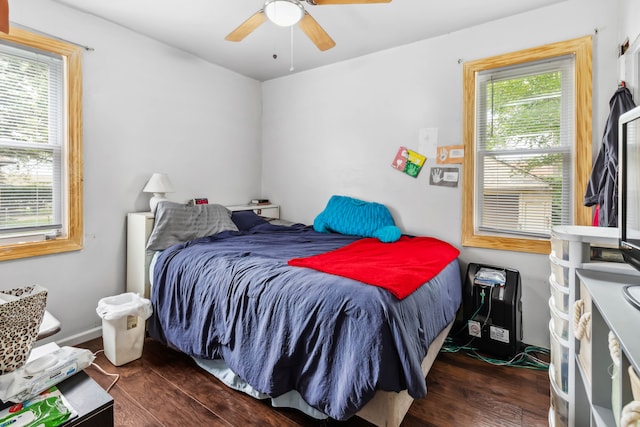 bedroom featuring dark hardwood / wood-style flooring and ceiling fan