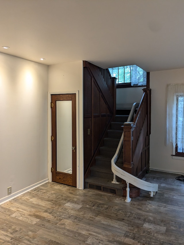 stairway featuring hardwood / wood-style flooring