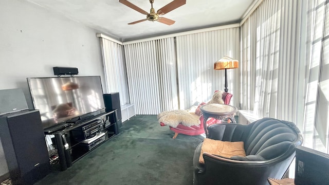 carpeted living room with ceiling fan