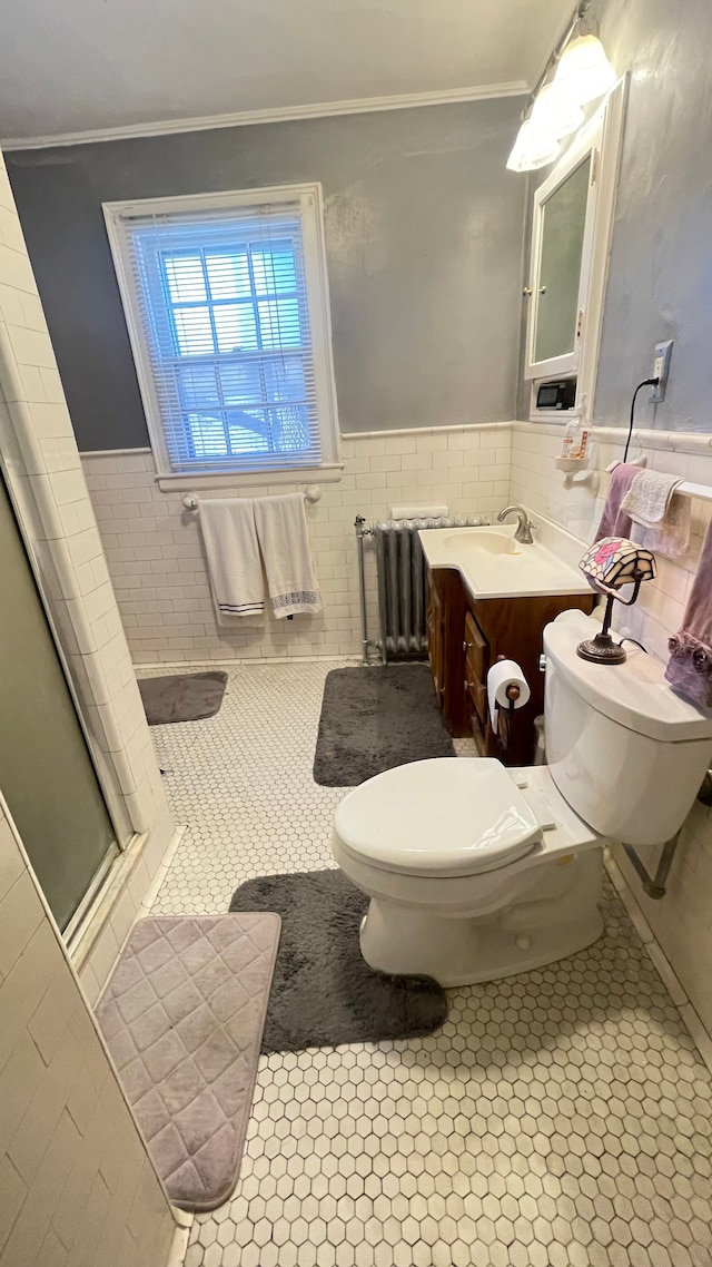 bathroom featuring radiator heating unit, tile walls, walk in shower, toilet, and tile patterned floors