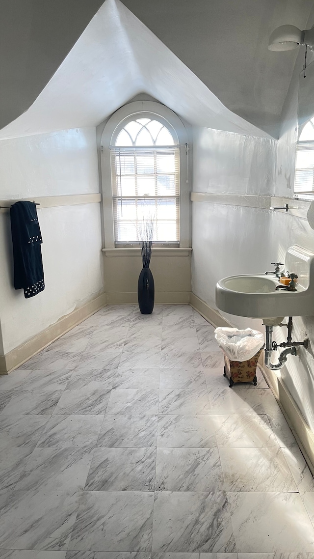 bathroom with vaulted ceiling