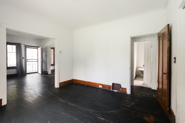 spare room featuring dark hardwood / wood-style floors