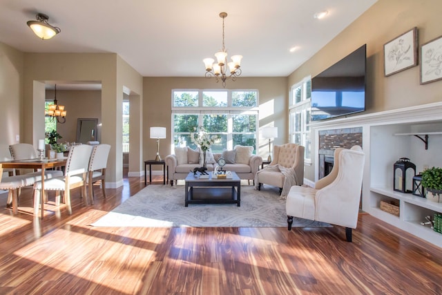 living room featuring a chandelier and hardwood / wood-style flooring