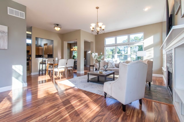 living room featuring hardwood / wood-style floors and a notable chandelier