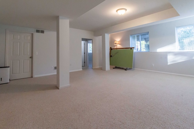 basement with light colored carpet