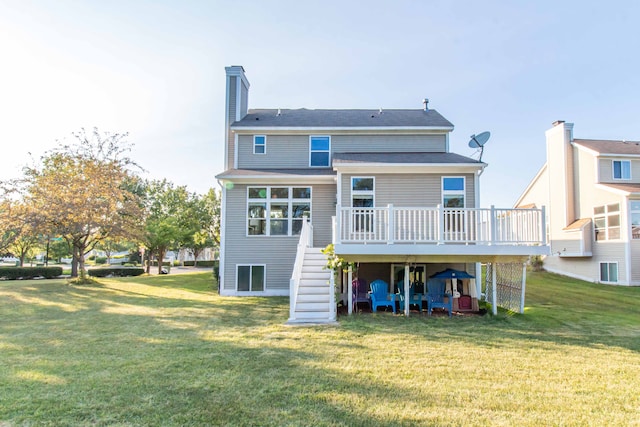 back of house with a lawn and a deck