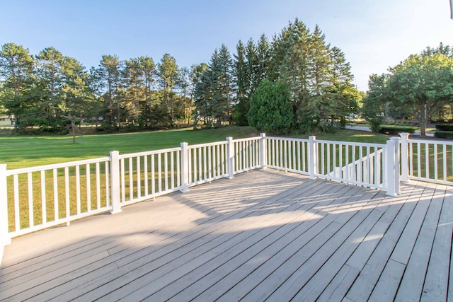 wooden terrace with a yard