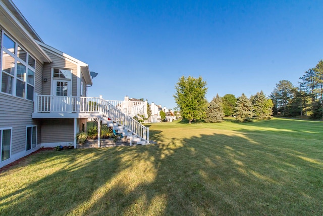 view of yard featuring a wooden deck