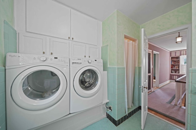 laundry area featuring cabinets, independent washer and dryer, carpet floors, and built in shelves